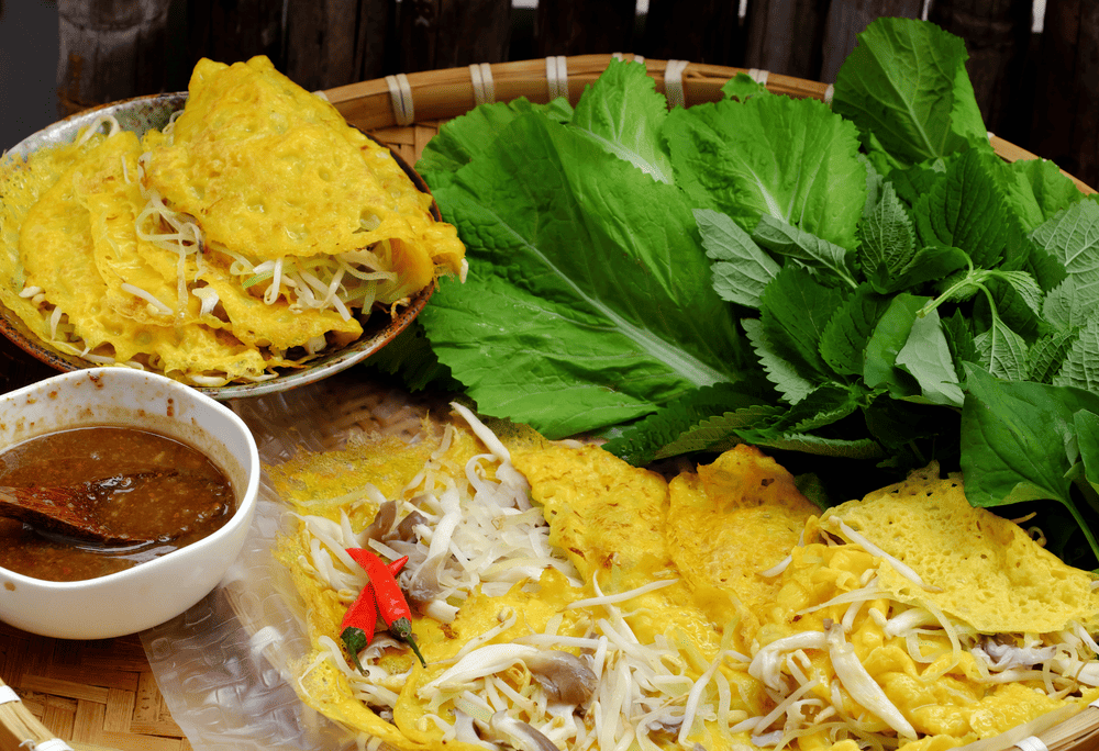 Banh xeo is crispy and golden with generous fillings and perfectly balanced dipping sauce that delights from the first bite (Source: Canva)